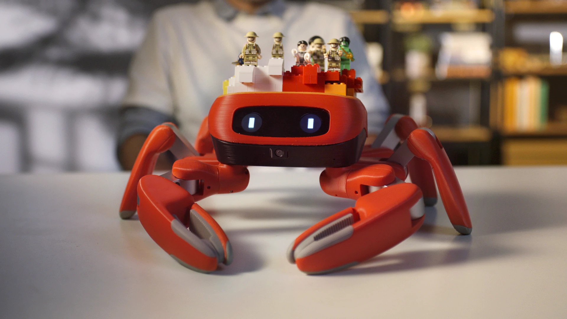 Jumper crab robot topped with building blocks